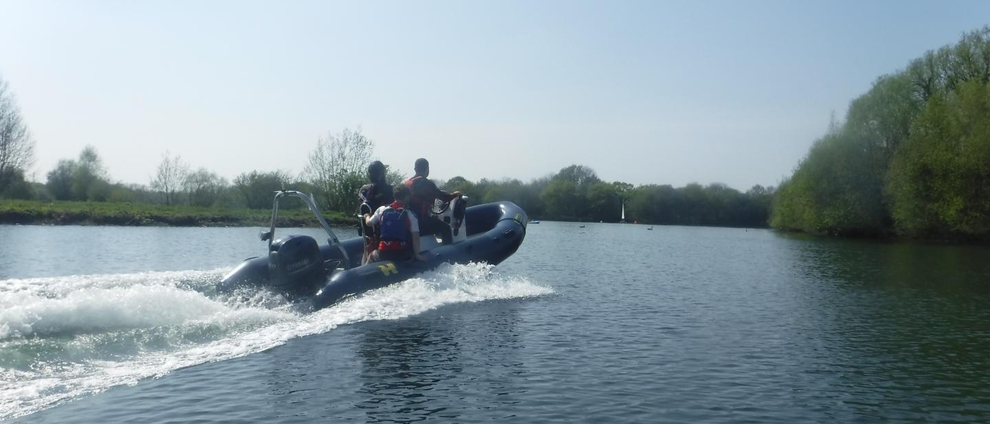 powerboat driving away from the camera